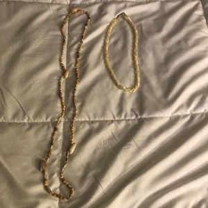 Both for $25. The long one is made of shells and the other is fresh water pearls